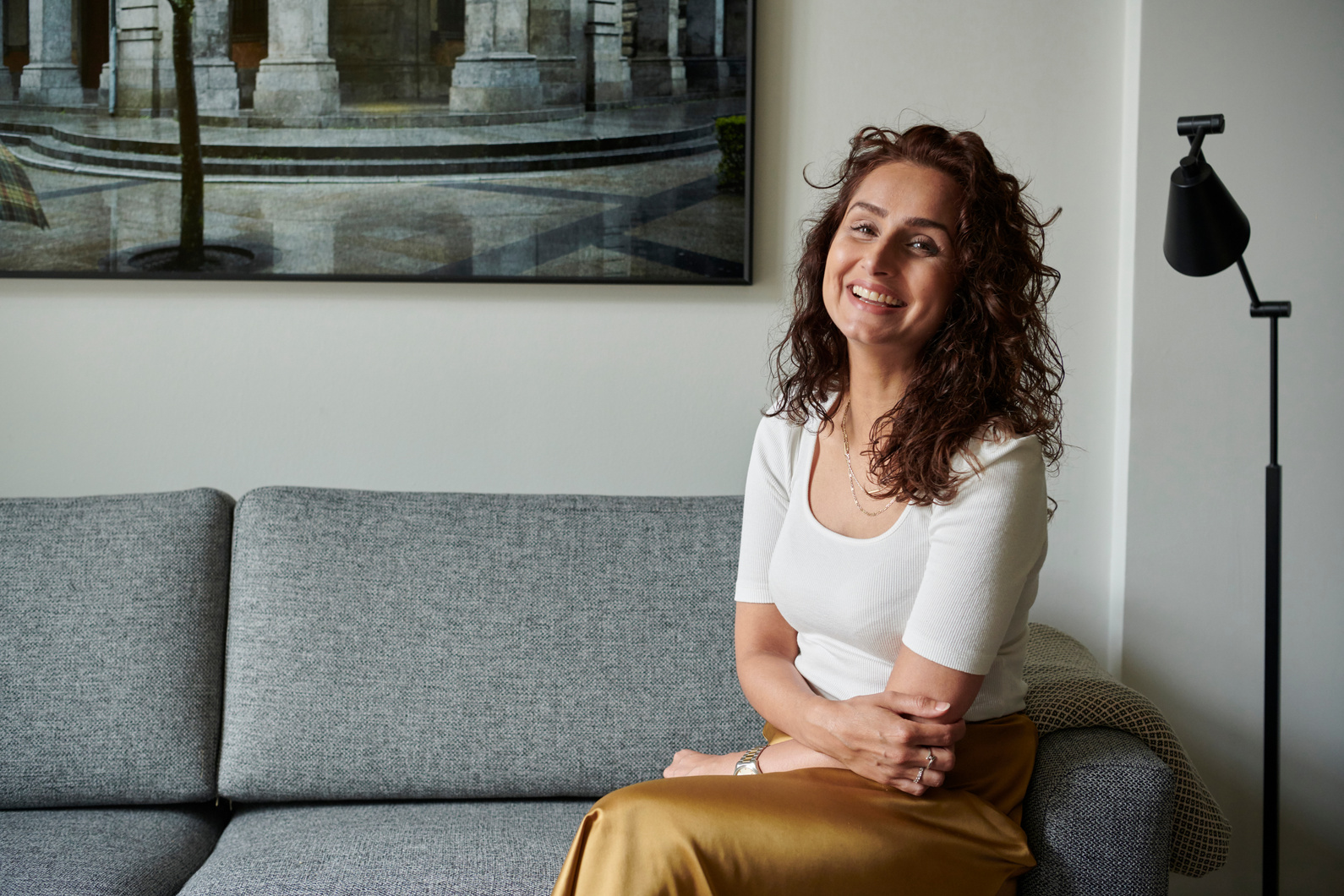 Attractive woman 40 years old sitting on couch